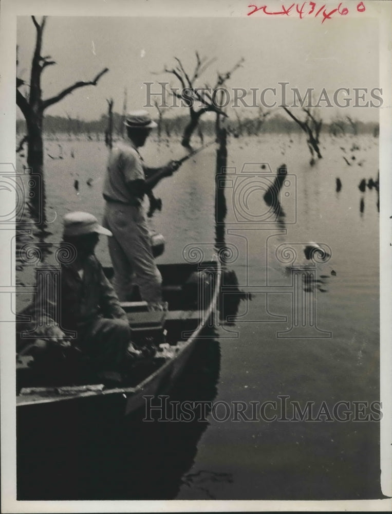 1986 Bob Stark and Lewis Cutrer fish at reservoir near Angleton - Historic Images