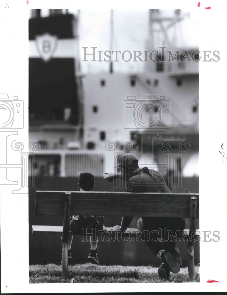 1992 L.R. Michaels with grandson Jeremey McCaa on bench in Houston - Historic Images