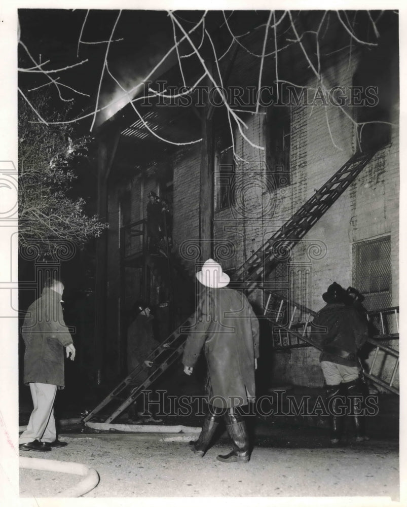 1955 Firemen on scene of fire in Houston, Texas. - Historic Images