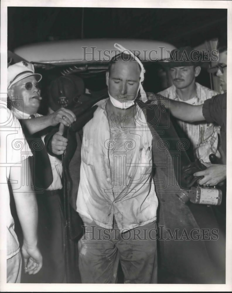 1954 Injured Houston fireman Chandler at Uptown Garage fire - Historic Images