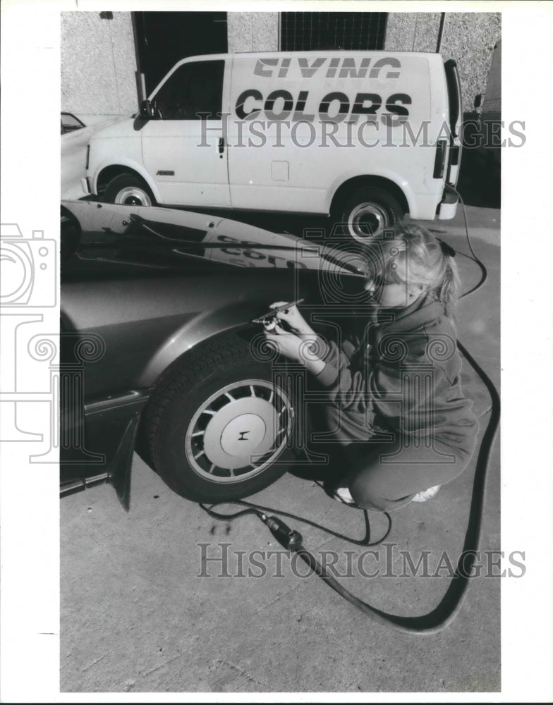 1988 Flying Colors Technician Denise Waters Touches Up Paint on Car - Historic Images