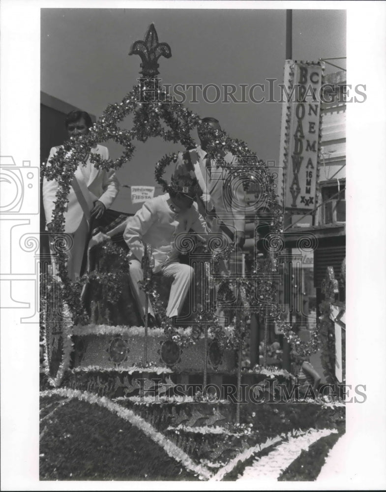 1980 Men on float at El Rey Feo Parade, Fiesta, San Antonio, TX - Historic Images