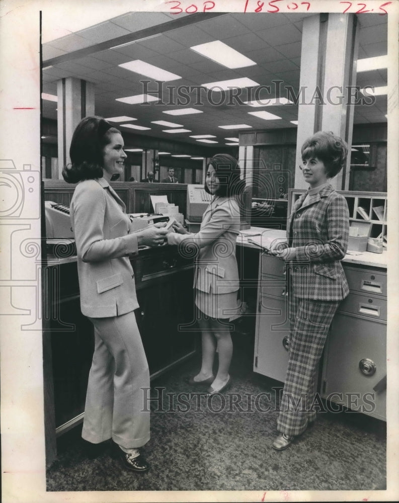 1969 Press Photo International Bank tellers model new uniforms - hca25848 - Historic Images