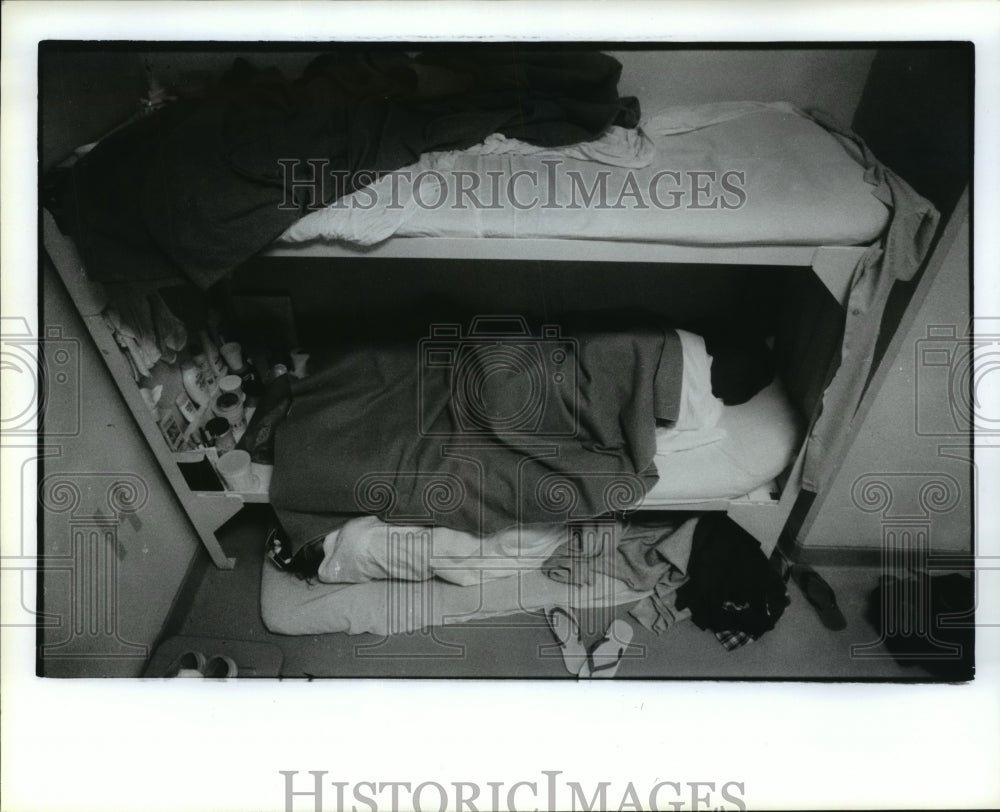 1990 Woman sleeps on floor at Harris County Jail - Historic Images