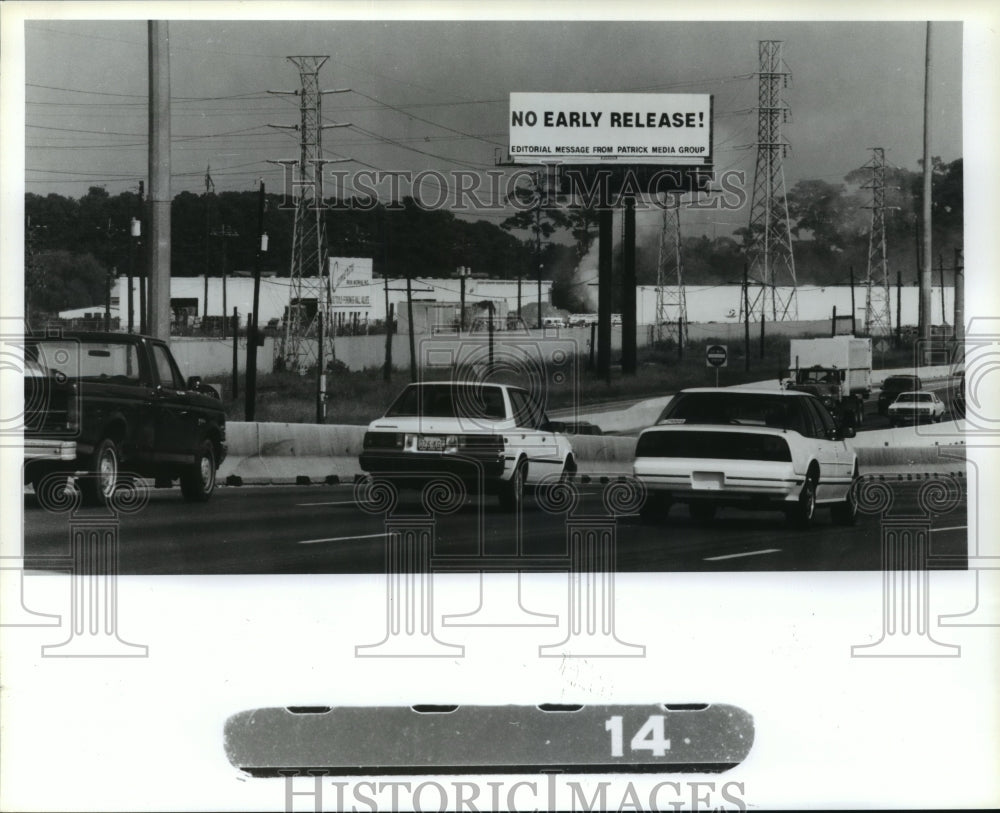 1990 Billboard reads &#39;No Early Release&#39; - Historic Images