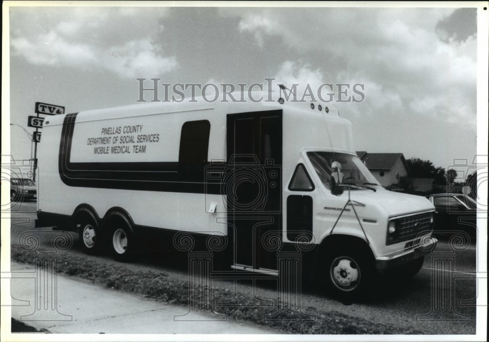 1989 Mobile medical van on road in St. Petersburg, Florida - Historic Images
