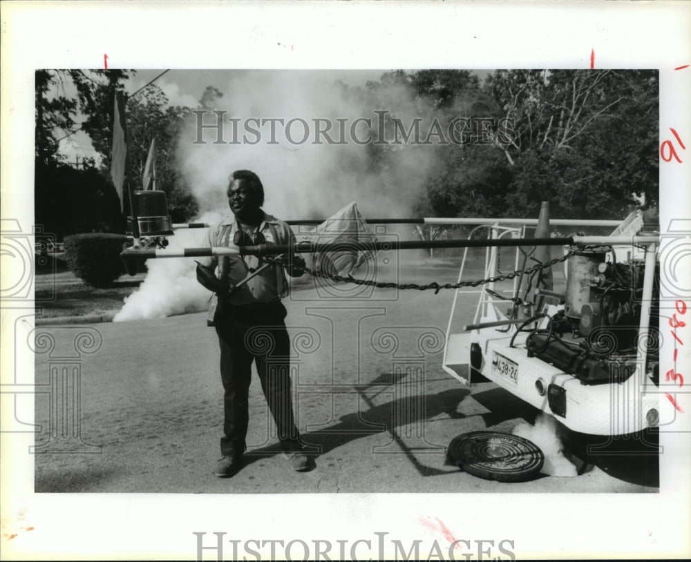 1985 Ray Edwards, Harris County Mosquito Control, Sprays Storm Sewer - Historic Images