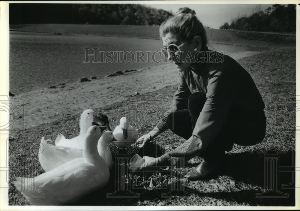 1988 Sharon Pfost feeds ducks at toxic waste site in WV - Historic Images