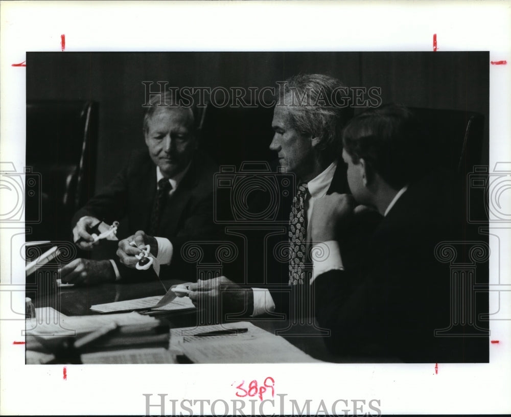 1991 Judge Jon Lindsay Passes Rattle to Commissioner Jerry Eversole - Historic Images