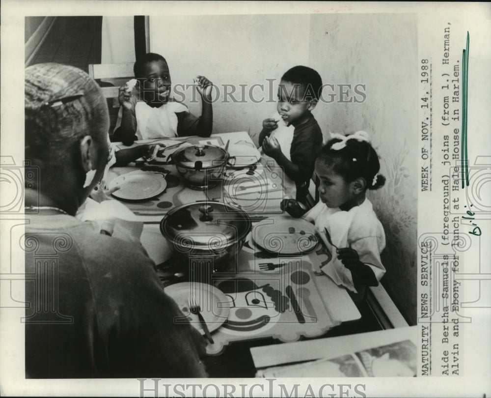 1988 Children eat lunch with aide at Hale House in Harlem - Historic Images