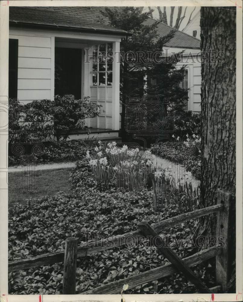 1992 Flowers in front yard of home - Historic Images