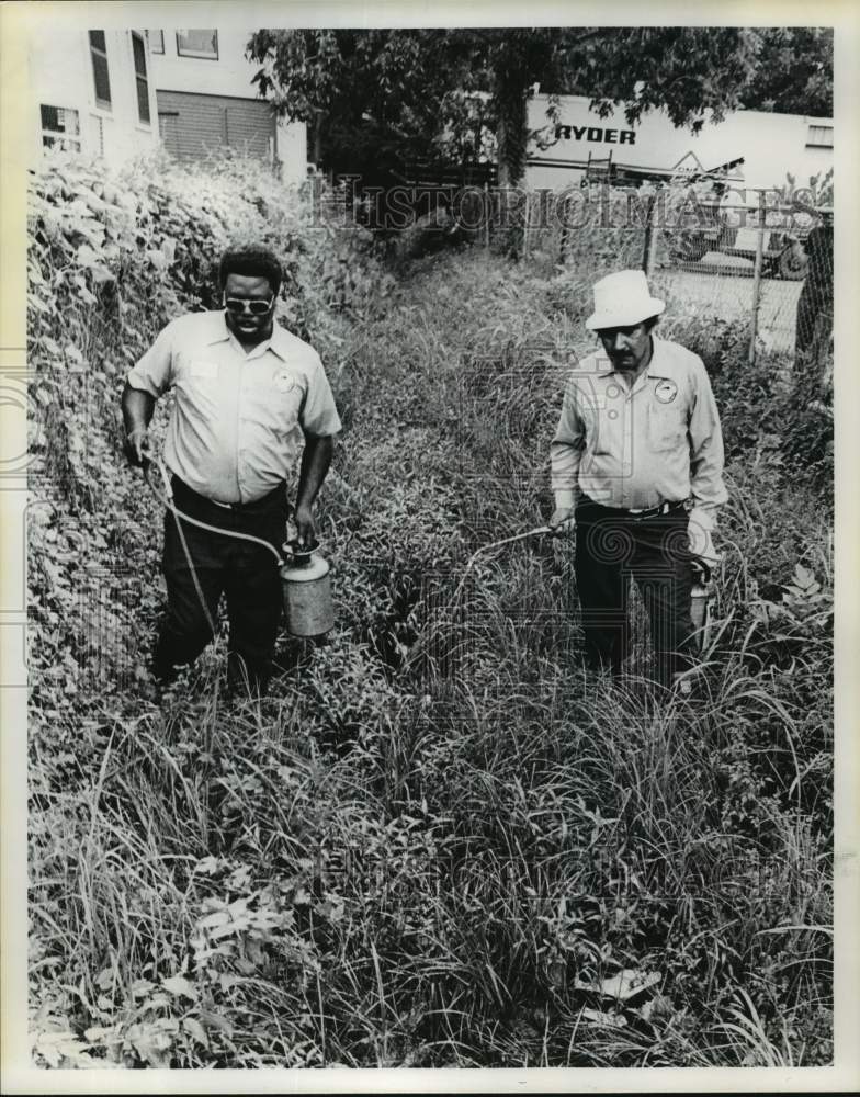 1975 Harris County Mosquito Control District employees spray in TX - Historic Images