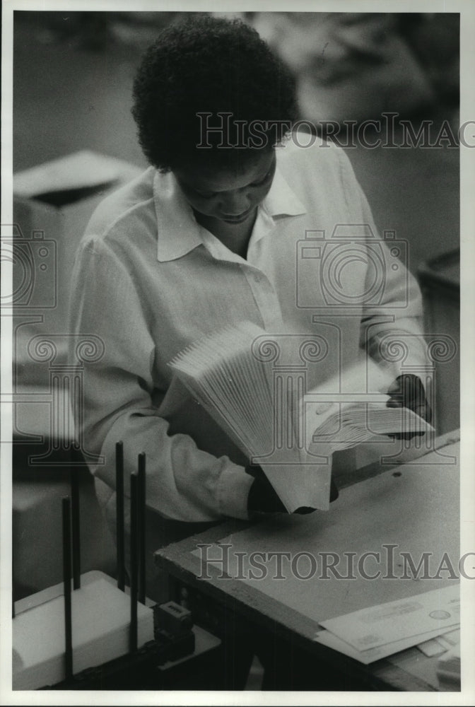 1984 Jacqueline Smith looks at mail at TX Harris Co Appraisal Dist - Historic Images