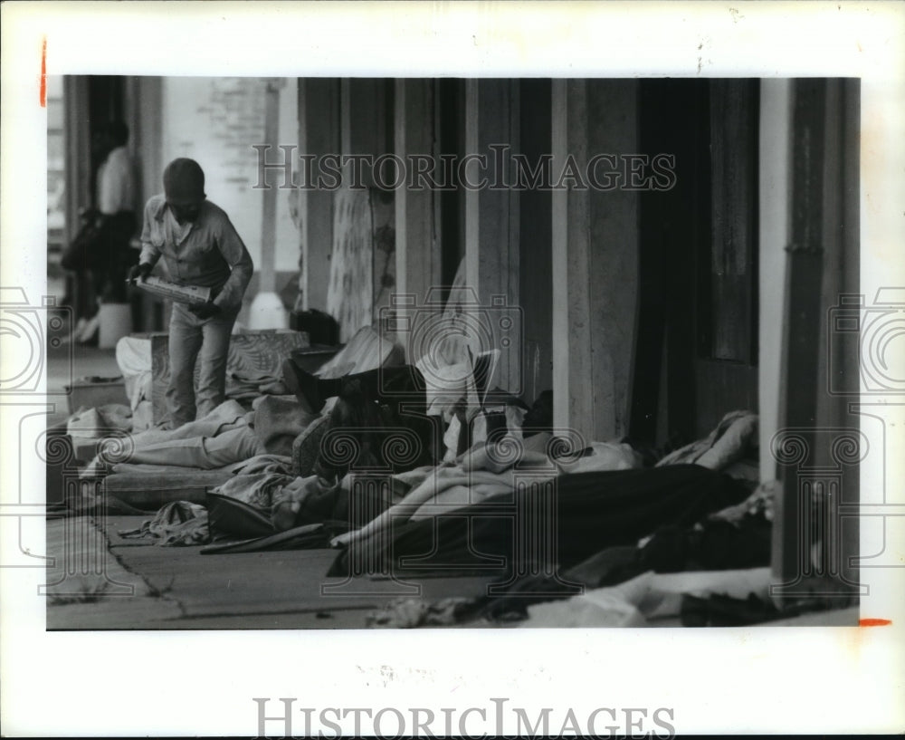 1989 Homeless men sleep outside former homeless shelter in Houston - Historic Images