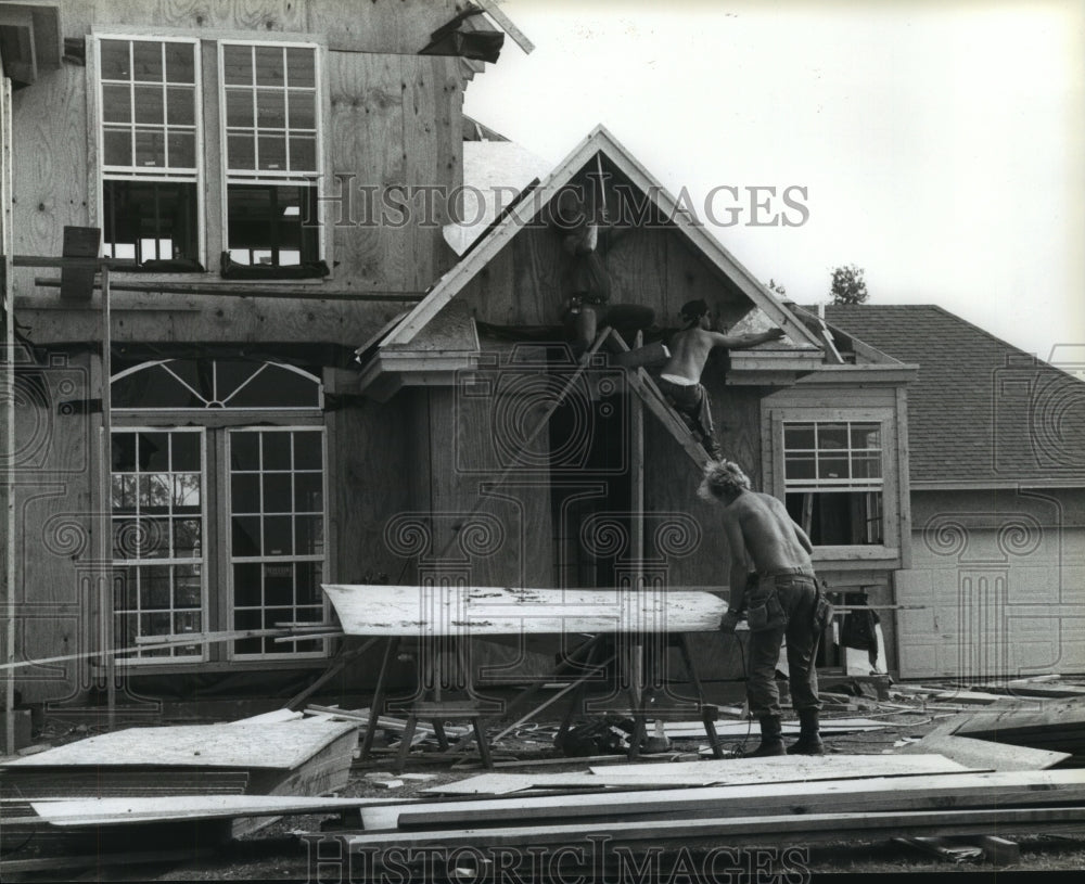 1990 Workers at Bay Glen home construction site in Clear Lake City - Historic Images