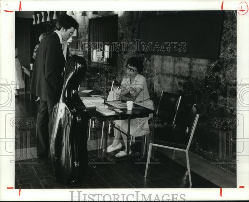 1982 Jonathan Spitz checks schedule at Hogg National Young Artist - Historic Images