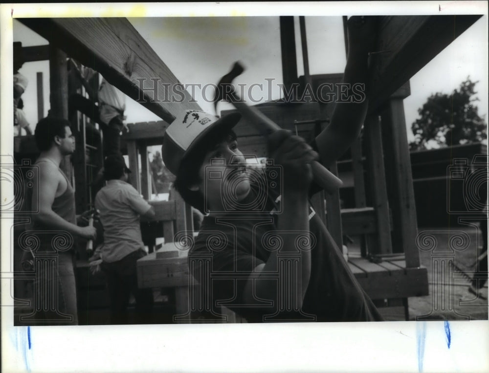 1987 Volunteer Joey Ramirez builds playground at Hidalgo Park - Historic Images