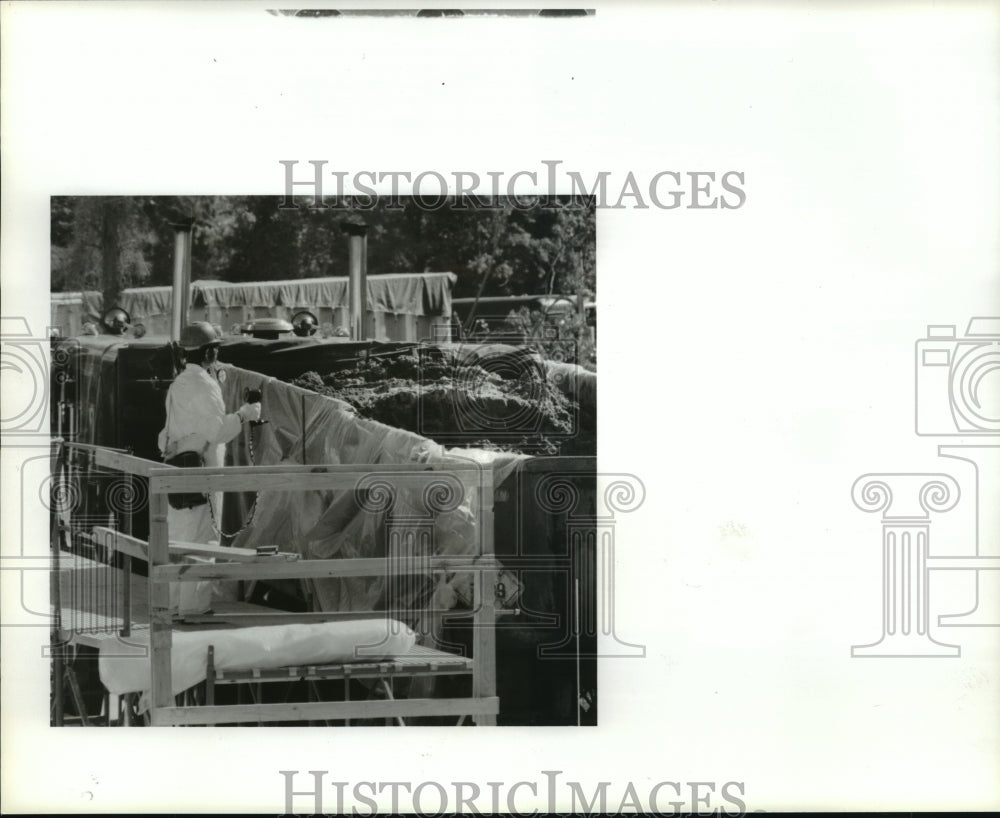 1987 Worker meters level of toxins at superfund site near Highlands - Historic Images