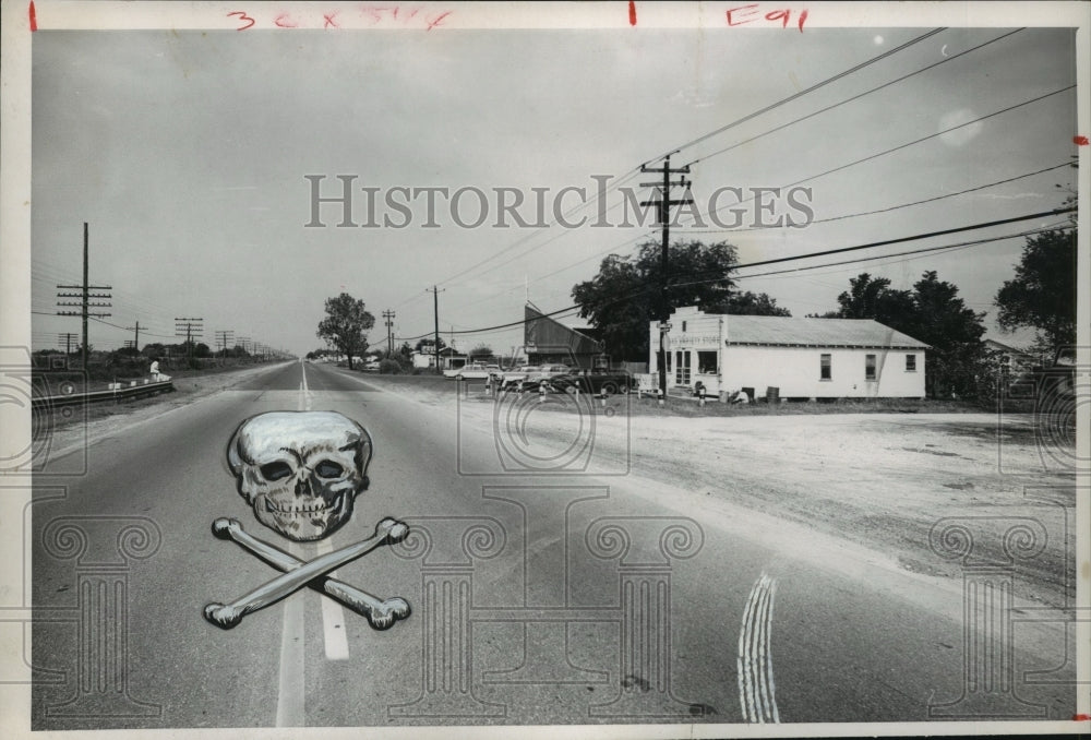 1960 Press Photo Graphic of scull and bones on top of street view of Hempstead - Historic Images