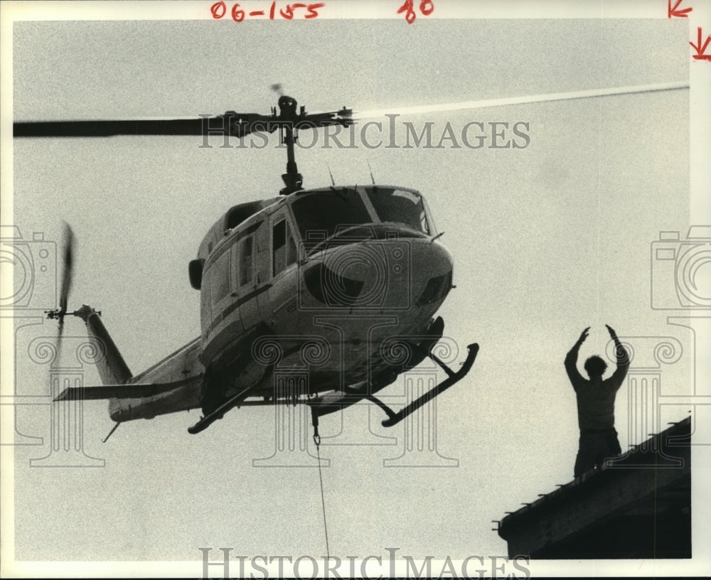 1980 Man directs helicopter in Houston landing - Historic Images