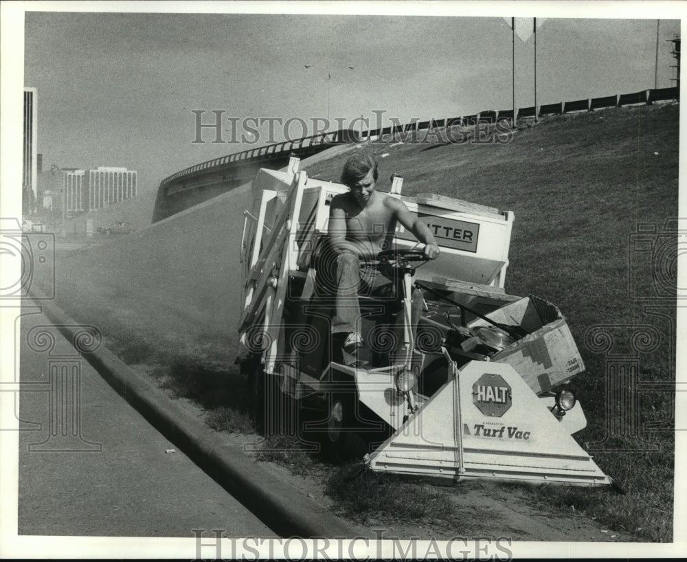 1978 Rod Wigley drives Houston Anti-Litter Team's vacuum along road - Historic Images