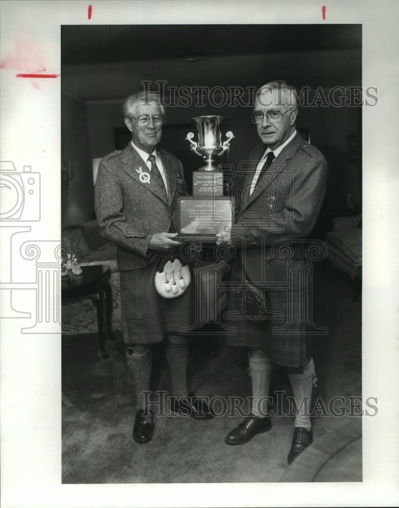 1990 Heather and Thistle Society Chieftains hold cup in Houston - Historic Images