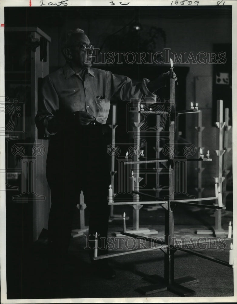 1969 Press Photo Ray Starke lights candles at Helena House in Houston-Historic Images