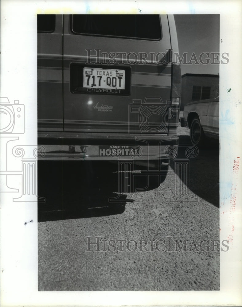 1989 "Save The Hospital" bumper sticker on van in Memphis, Texas - Historic Images