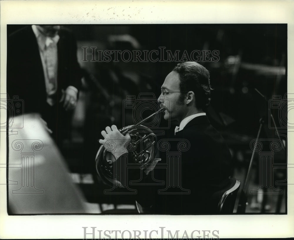 1981 Houston Symphony member plays instrument - Historic Images
