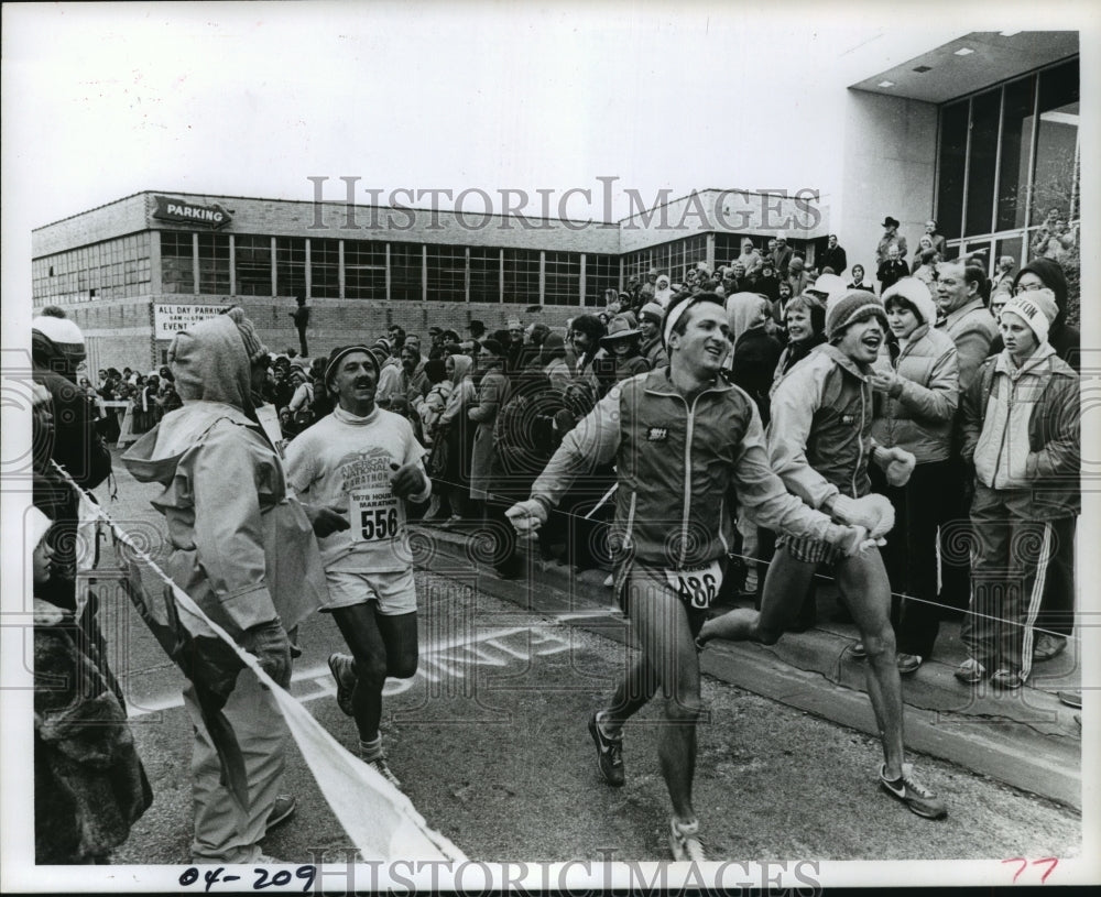 1978 Houston Marathon runners cross finish line.  #556, #486 - Historic Images