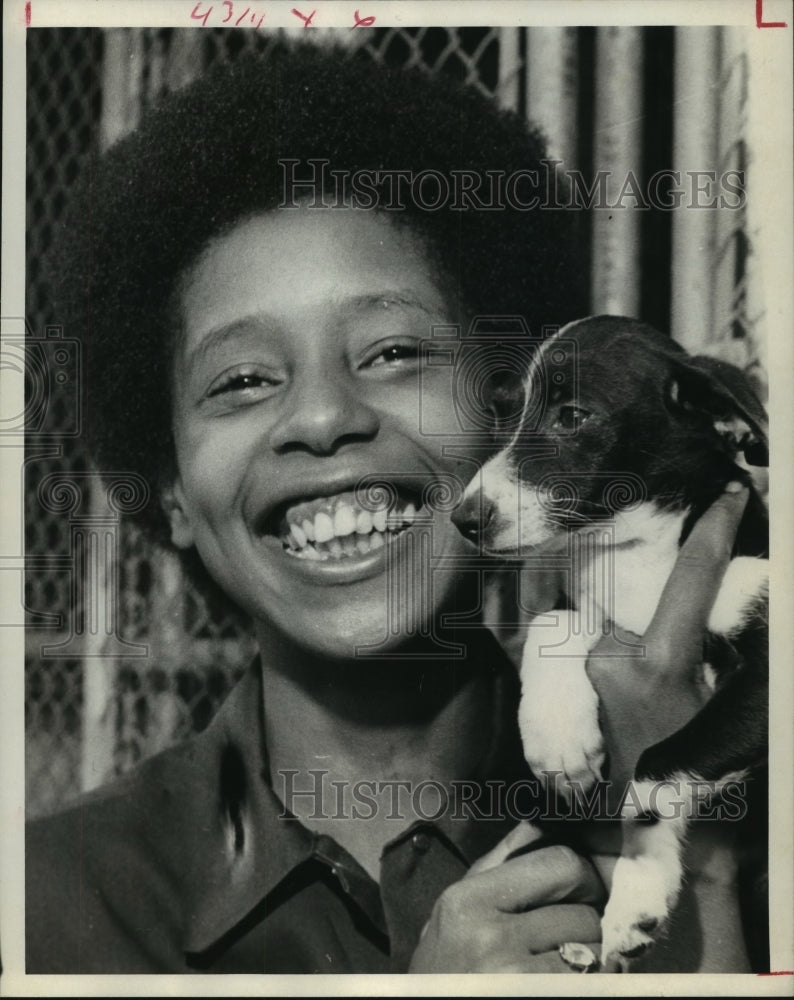 1975 Houston Rabies Control Center employee Gwen Jackson holds puppy - Historic Images