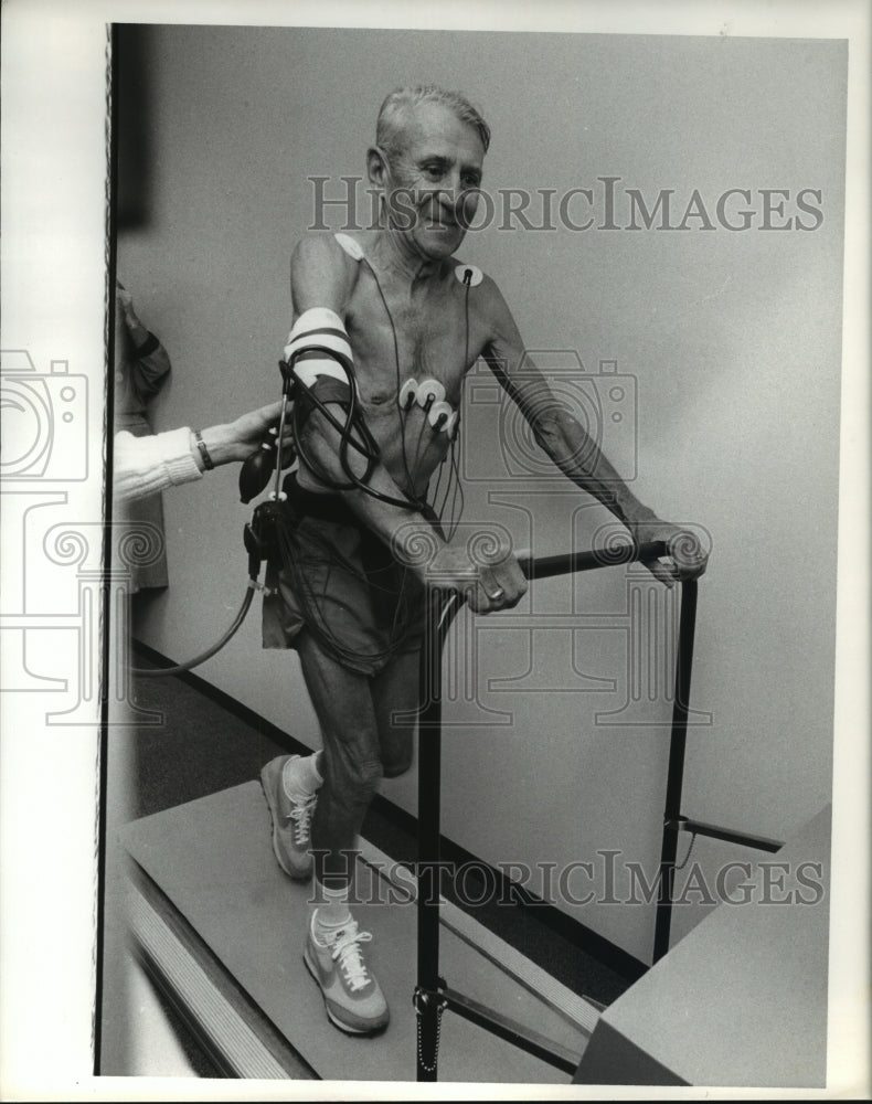 1979 Elderly man gets monitored while on treadmill; Houston Marathon - Historic Images