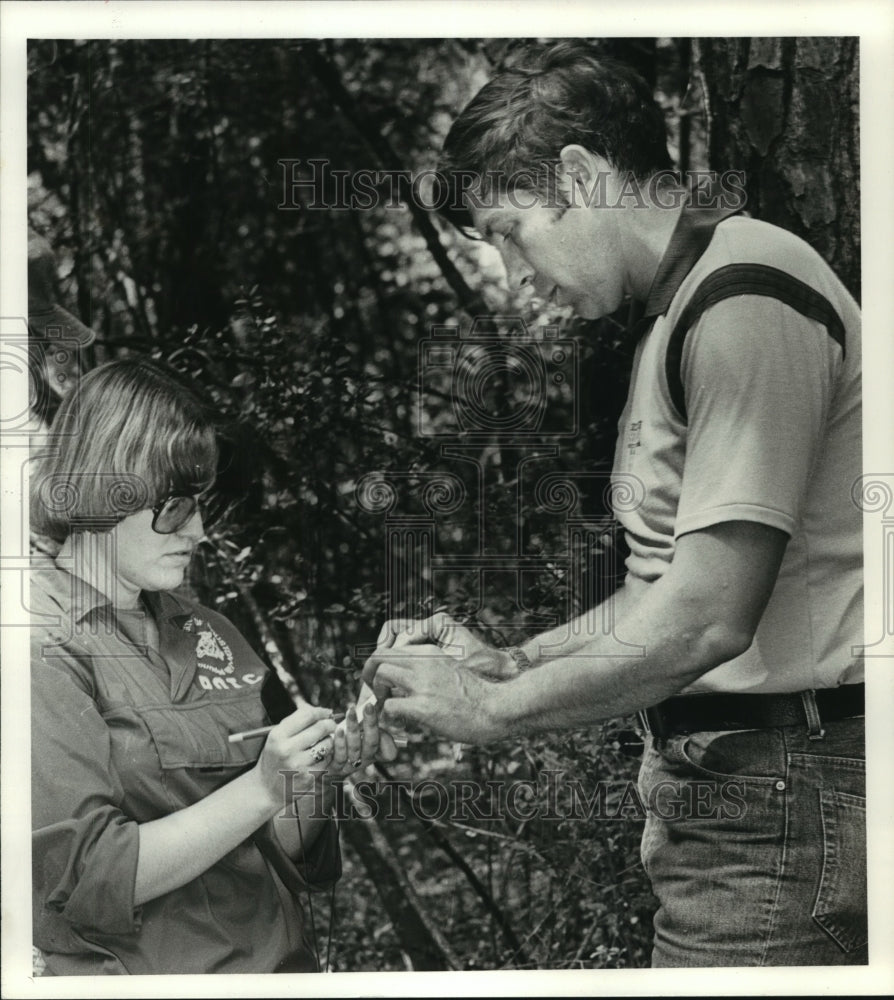 1986 Orienteering instructor Doug Duvall explains to Sue Sanders - Historic Images