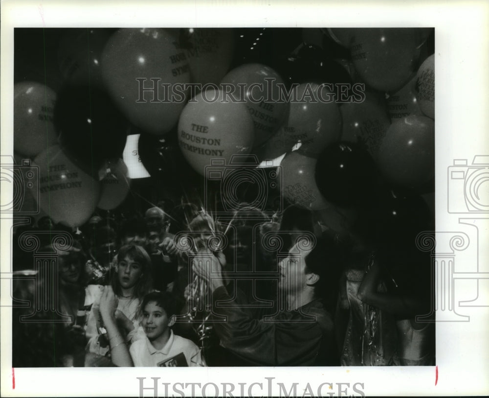 1989 Terrence Karn with balloons at Houston Symphony party - Historic Images