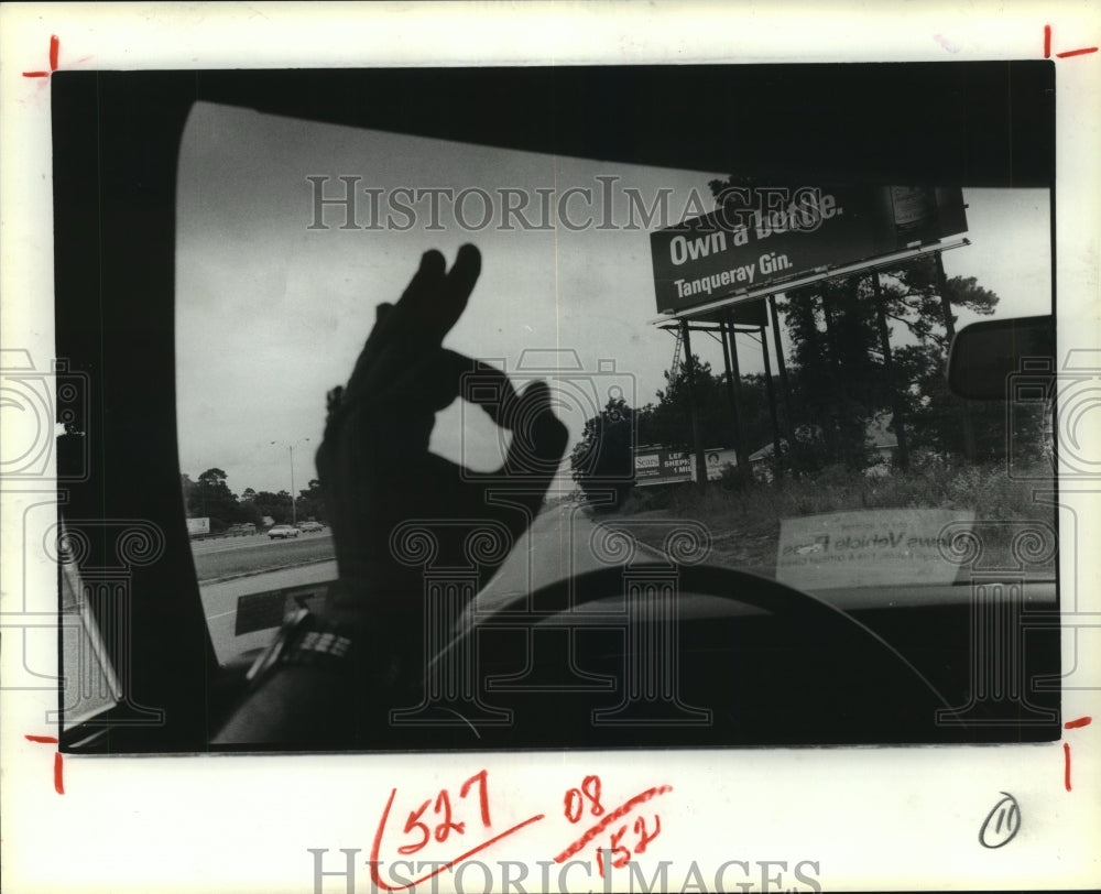 1981 View from car shows Gin sign and OK sign with hand - Historic Images