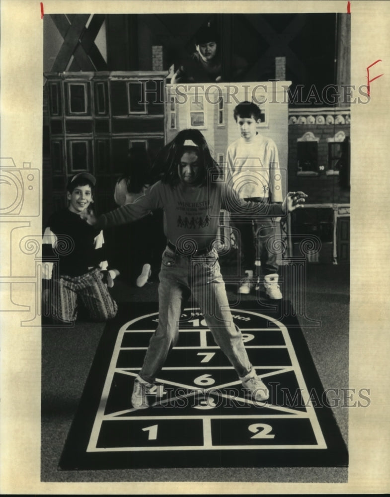 1995 Children play hopscotch in Boston Children&#39;s Museum-Historic Images