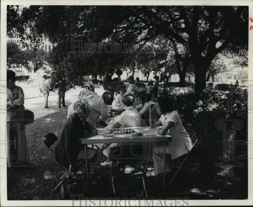 1975 People enjoy games with Houston Parks &amp; Rec at City Hall park - Historic Images