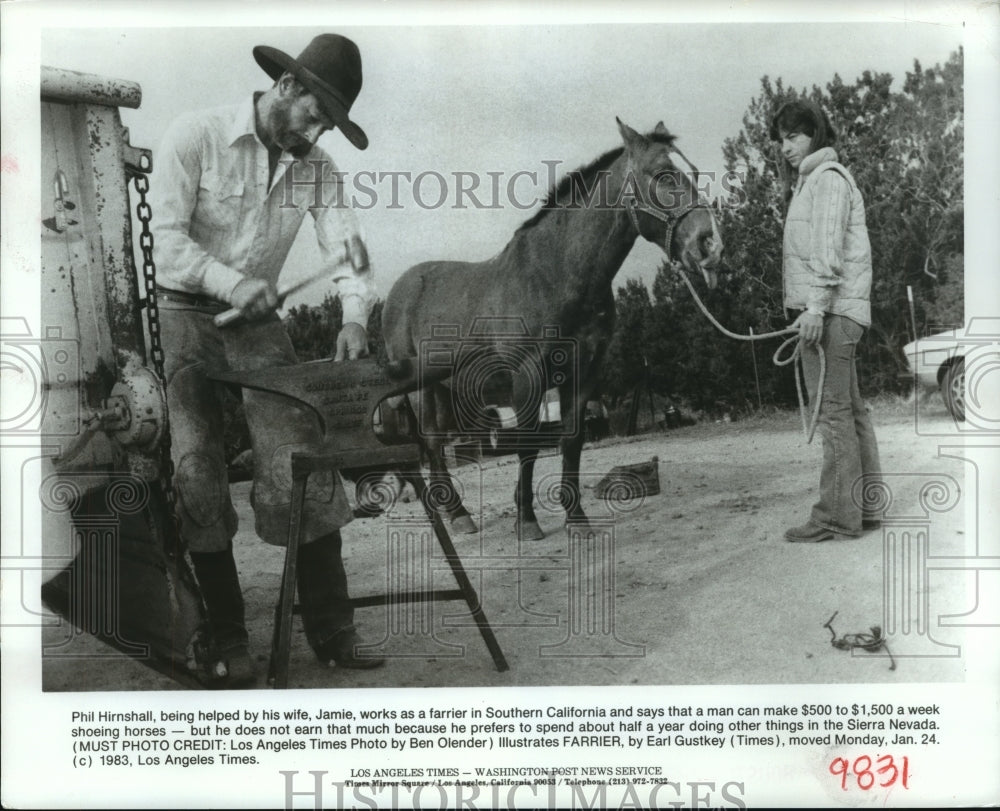 1983 Farrier Phil Himshall at anvil while wife holds horse in CA - Historic Images