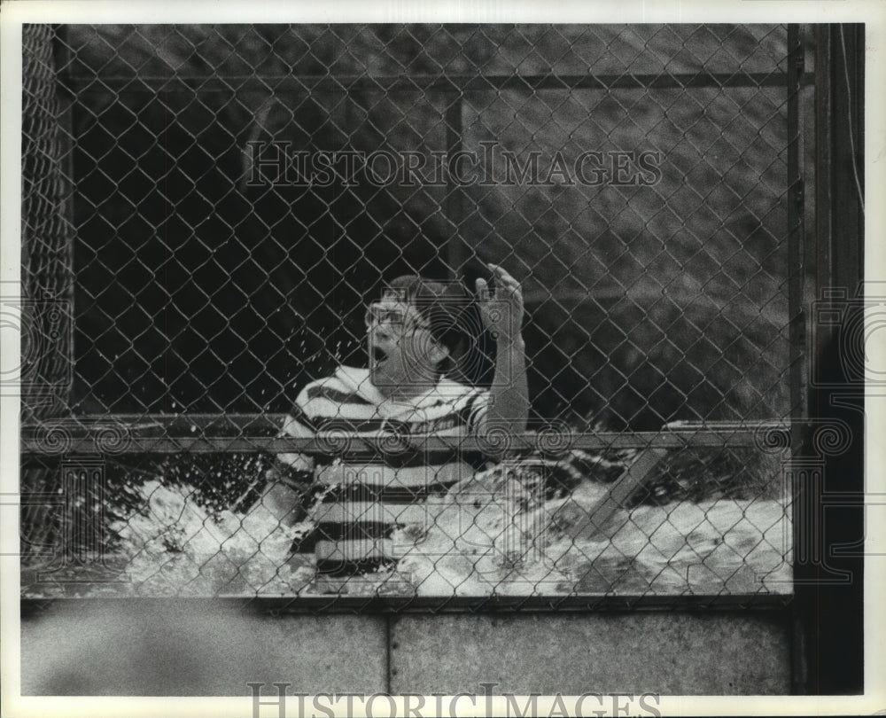 1984 John Meiswender in dunk tank at Kinkaid School - Historic Images