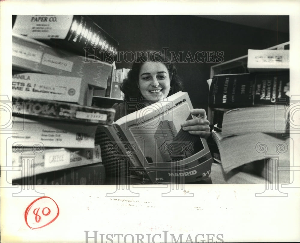1980 Sara Wohlschlag reads book on Madrid at Houston Public Library - Historic Images
