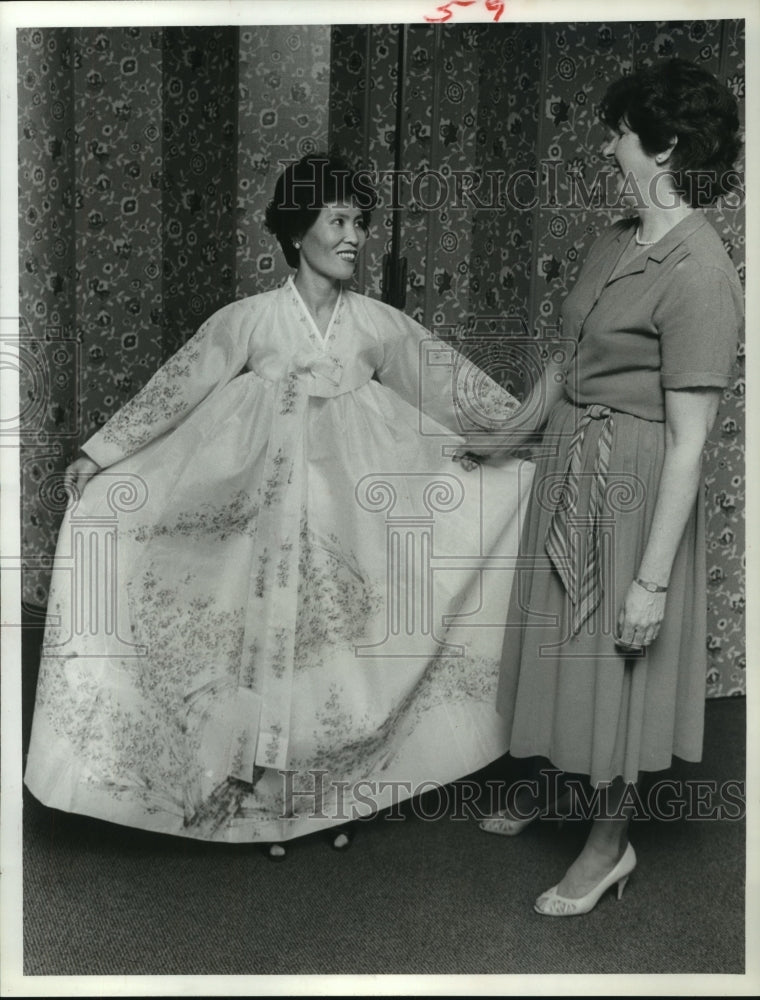 1985 Mrs. Sung-ha Choi models Korean dress for festival in Houston - Historic Images