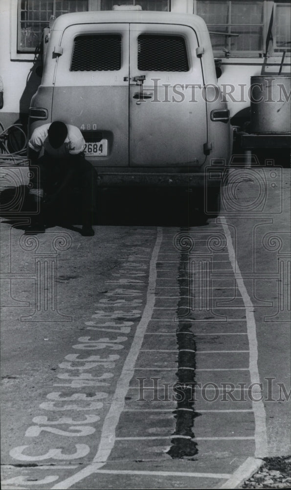 1966 Press Photo Man sits on back bumper of car at Houston Prison Farm - Historic Images