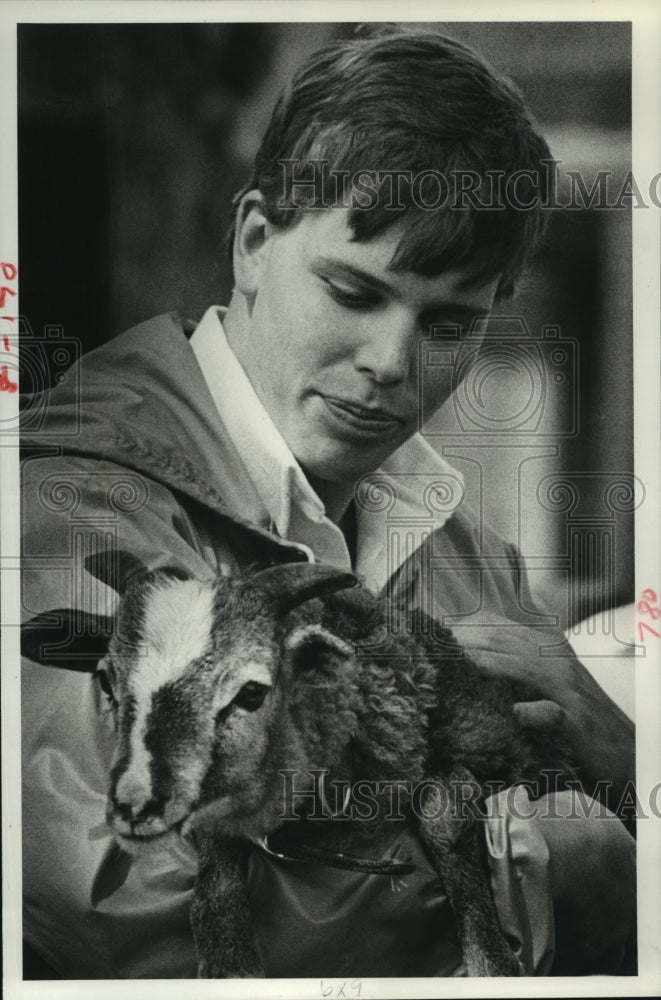 1983 Marian High agricultural student Steve Cloutier holds goat - Historic Images