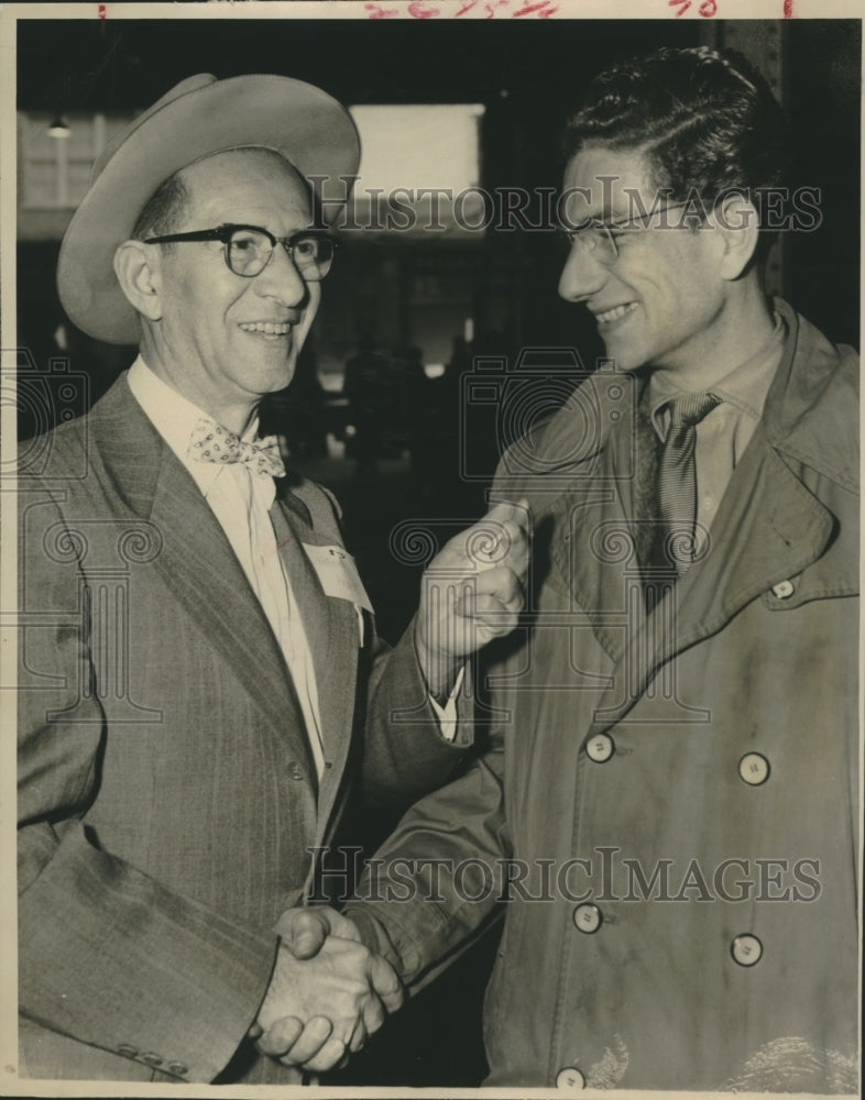 1957 Rene Horvath greets Hungarian refugee in Houston - Historic Images