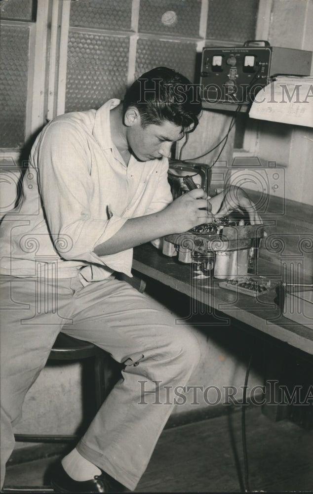 1956 Hungarian refugee works on equipment in Houston - Historic Images