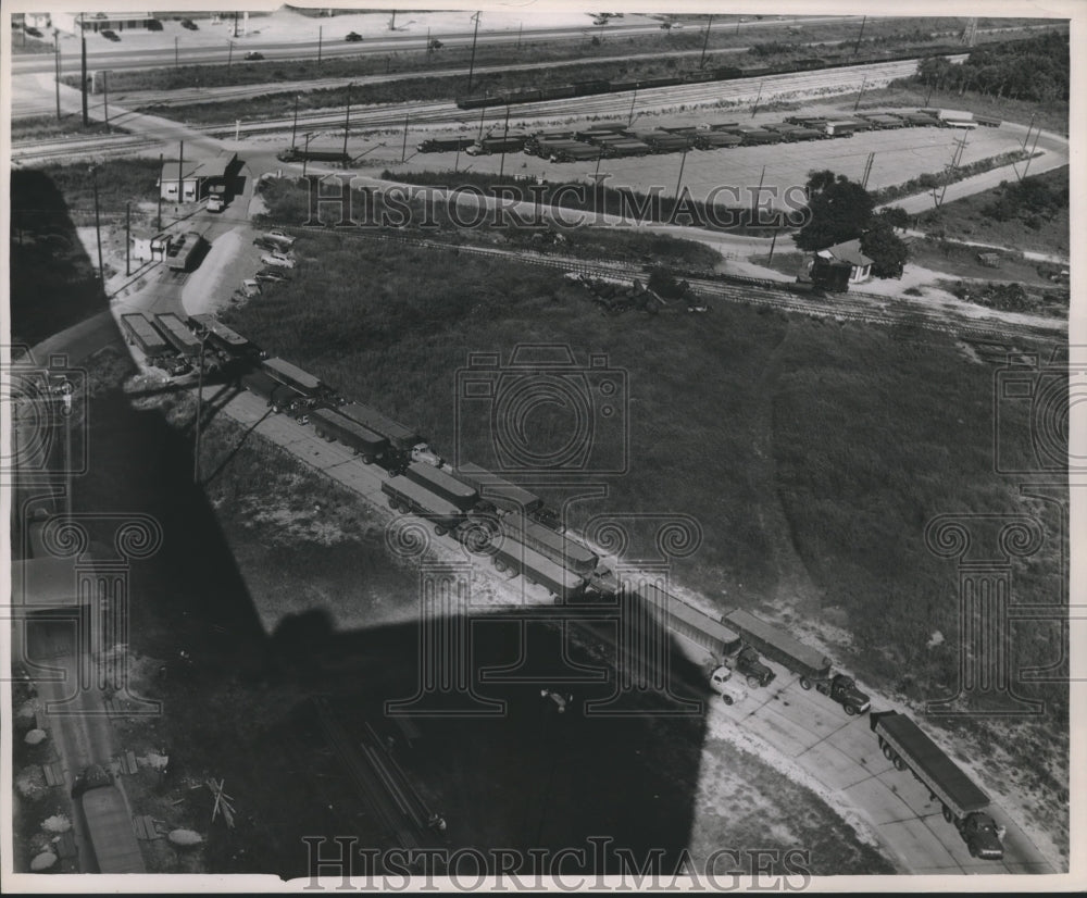 1953 Trucks line up at a Houston grain elevator - Historic Images