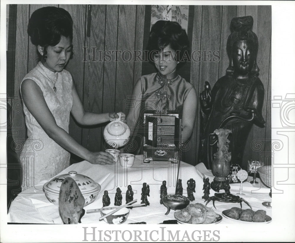1973 Happy Buddha employees display art at Gulf Coast Folk Festival - Historic Images