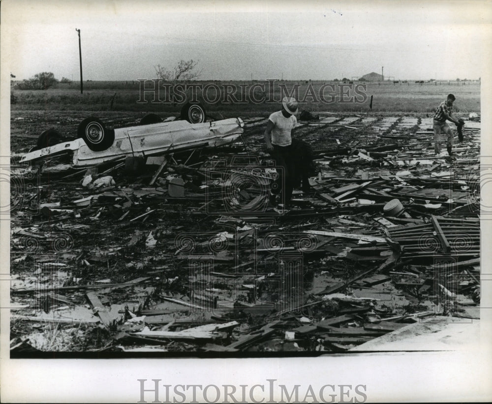 1967 Press Photo Men survey damage and debris from Hurricane Beulah - hca35260 - Historic Images