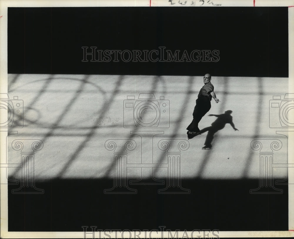 1974 Rt. Rev. Msgr. Lagana skates at Houston's Galleria ice rink - Historic Images