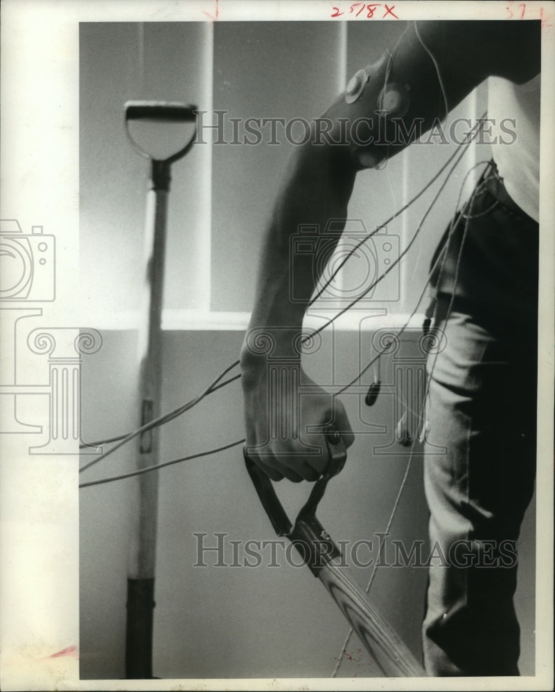 1969 Press Photo Man hooked up to electrode wires as he works - hca35805 - Historic Images